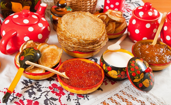 Russian people welcome the coming of spring with stacks of blinis 